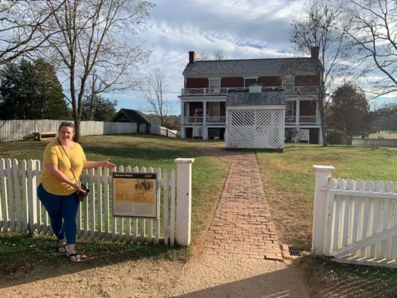 My wife stands before the McLean House, which is where General Robert E. Lee surrendered to the Union in 1865.