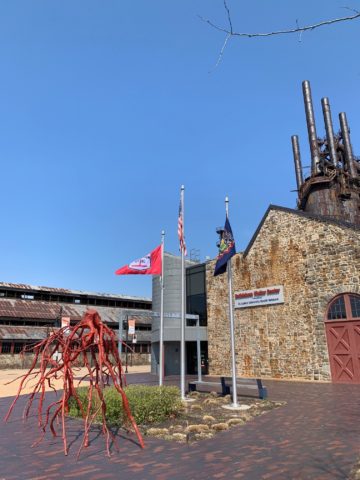 Bethlehem Steel flags and steel stacks in the background.