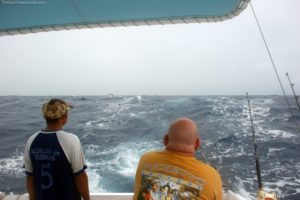 Jim reeling in the huge Wahoo fish he caught deep sea fishing in Aruba.