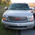 The SUV that rear-ended me during rush hour traffic on the way to work. Here, the driver, a VERY nice gentleman, was writing down his information for me, but we never reported it as an accident, nor turned it in to our insurance companies.