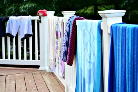 At a hotel, you have to resort to using the balcony railing to air dry swimsuits, towels, and other wet clothes.