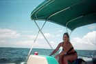 Our friend Aimee joyriding on a pontoon boat in Pensacola.