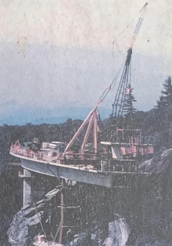 This image of construction on the Linn Cove Viaduct is seen on an historical placard near the National Park Service's Linn Cove Viaduct Visitor Center in North Carolina. 