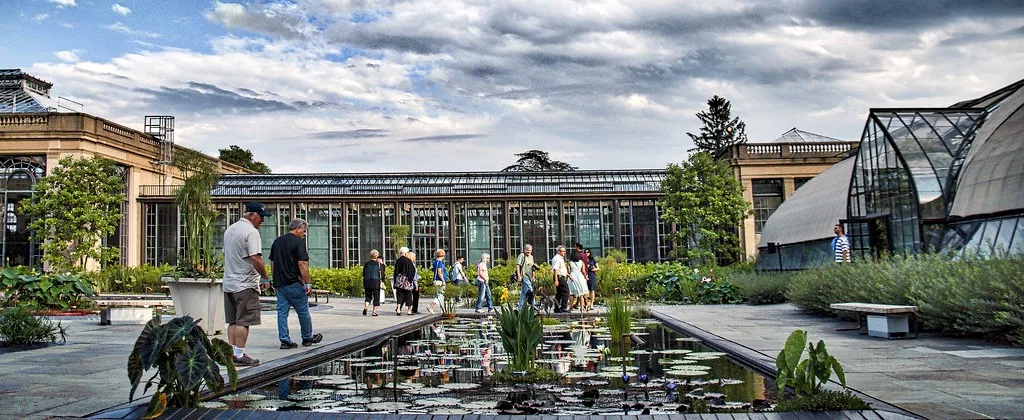 This is the courtyard view of the Conservatory greenhouses at Longwood Gardens - with a Waterlily pond.