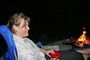 Lynnette hanging out by the campfire.