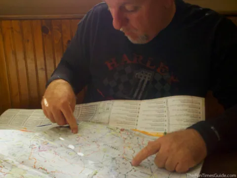 Jim is plotting our course for adventure on our first multi-day motorcycle ride. Here he is pointing to the area I am about to photograph using the CamScanner app. We used the harley davidson apps as well.