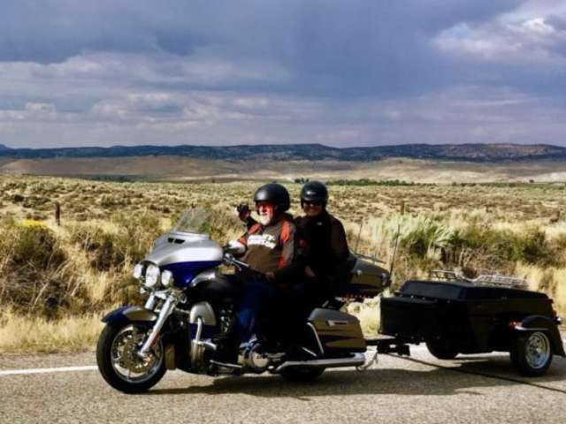 I'm taking a picture of my friend Kay taking a picture of us riding with our pull-behind motorcycle trailer.