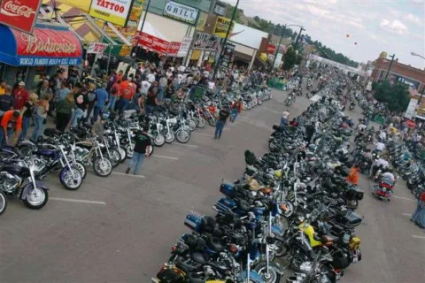 Downtown Main Street Sturgis - notice the bike parking along the curbs and down the middle - with motorcycles permitted to drive on the road in between. 