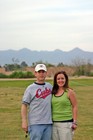 Neil and Abby at Hohokam Park for a Chicago Cubs game with the Arizona mountains in the background.