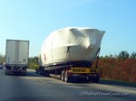 Oversize load - transporting a yacht via tractor-trailer.