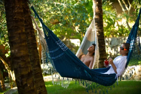 Relaxing in hammocks at a secluded beach resort. 