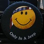 Scruffy Jeep smiley face tire cover