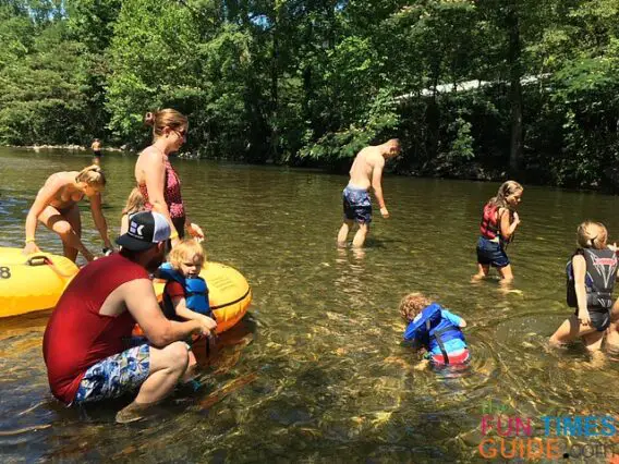Kids of all ages playing in the shallow water while river tubing with River Rat. 