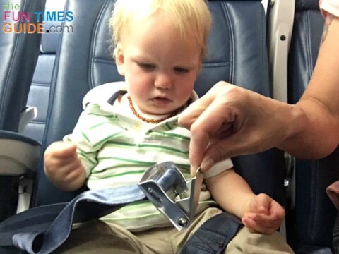 When using a car seat on a plane, you definitely need to consider how your car seat will be secured on the plane -- keeping the airplane lap belt buckle in mind.
